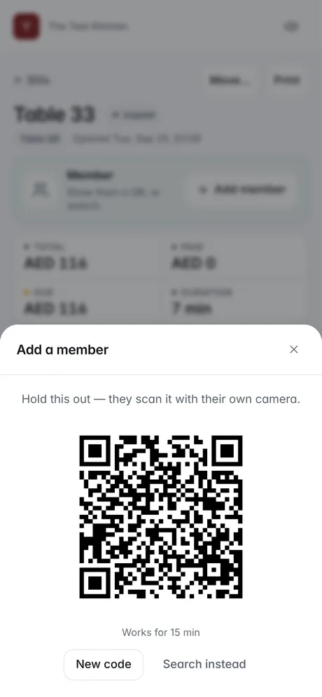 A bill on a waiter's phone showing its claim QR, for the guest to scan
